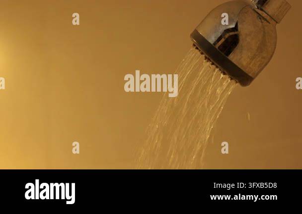 Shower head releasing water against yellow background Stock Video ...