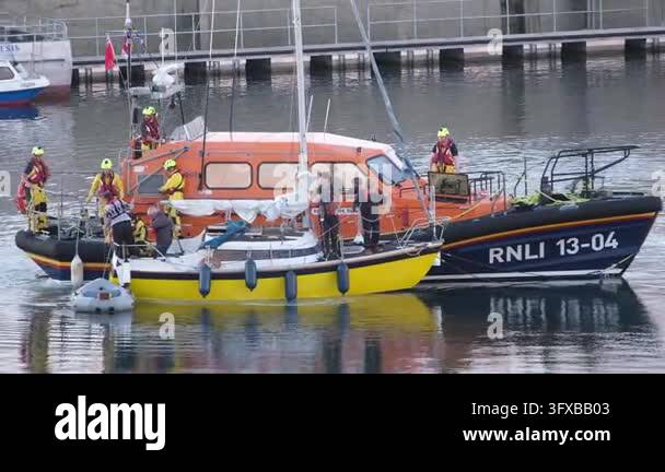 Seahouses, Northumberland, UK, 06.25.2026. RNLI in action.. A fishing ...