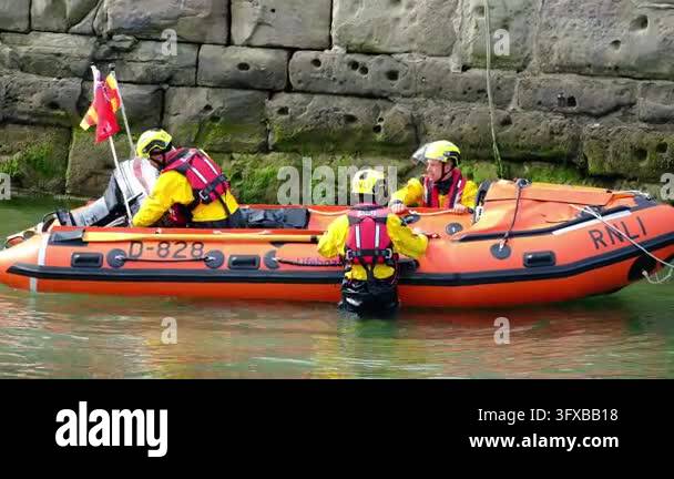 Seahouses, Northumberland, UK, 06.25.2026. RNLI in action.. A fishing ...