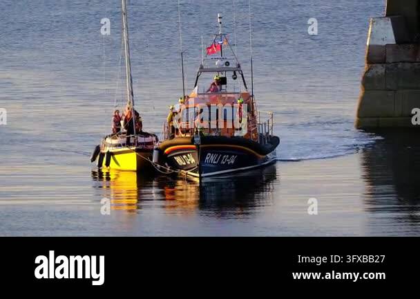 Seahouses, Northumberland, UK, 06.25.2026. RNLI in action.. A fishing ...
