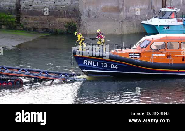 Seahouses, Northumberland, UK, 06.25.2026. RNLI in action.. A fishing ...