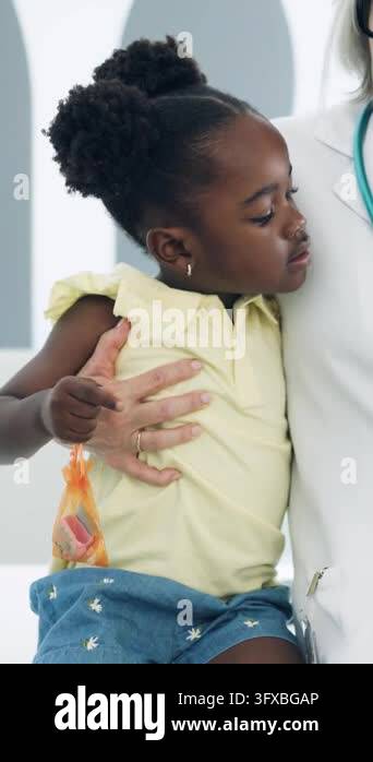 Anxious african american girl feeling safe in the arms of a caring ...