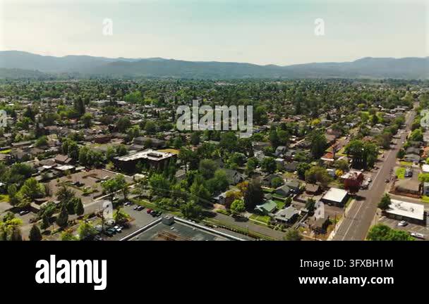 Aerial panorama over tree lined residential neighborhoods in Medford ...
