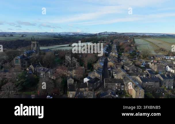 Prominence 4k Aerial drone footage flying over a quaint village with stone houses and ...