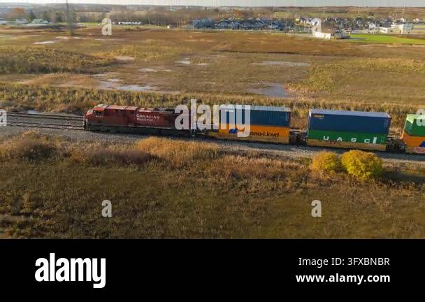 Canadian Pacific, Aerial drone footage of a long freight train with ...