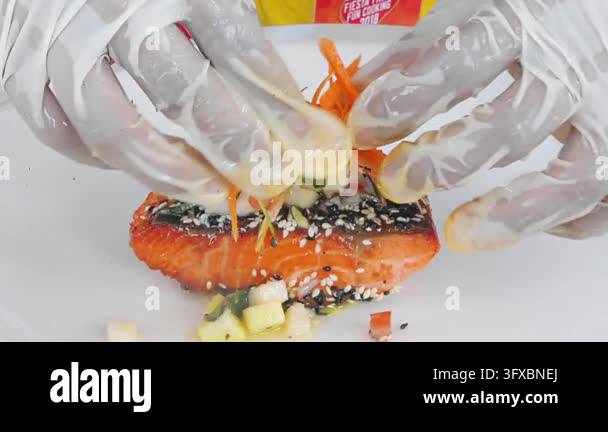 Sesame crusted grilled salmon garnished with fresh grated carrot Stock ...