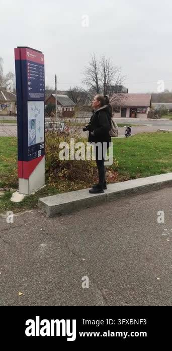 Slightseeing Female traveler pointing at tourist information guide map board ...