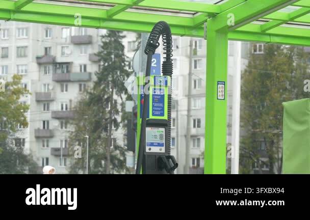 Vector Controller Stand Riga, Latvia - October 14, 2026: Green car wash station with coiled ...