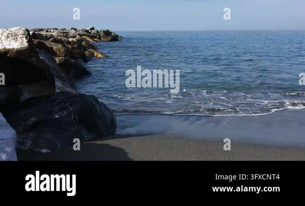 Water Science Model Stone breakwater rocks sea waves Sestri Levante sandy beach coast ...