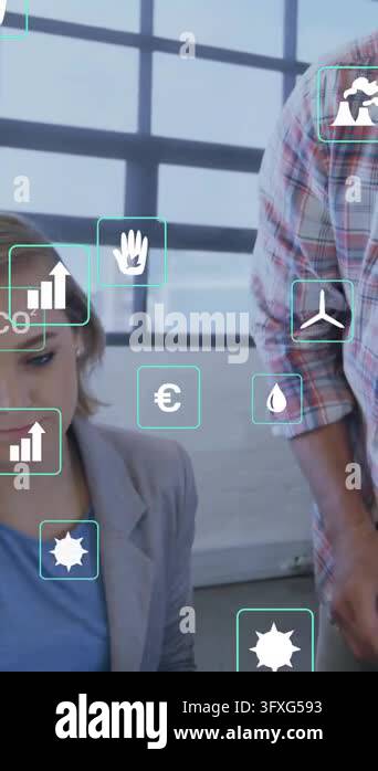 Animation of ecology icons over caucasian colleagues using computer in ...