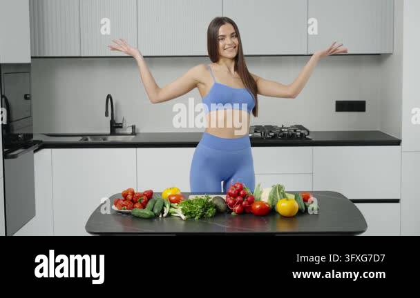 Fit woman promoting healthy eating with fresh vegetables Stock Video ...