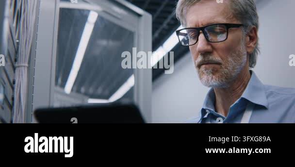 Experienced IT Executive Analyzing Server Performance Indicators ...