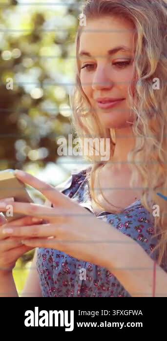 Holding smartphone and smiling, woman with sports icons animation over ...