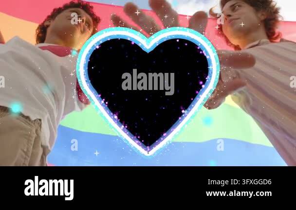 Two men clasping under rainbow flag hands meeting animating heart into ...