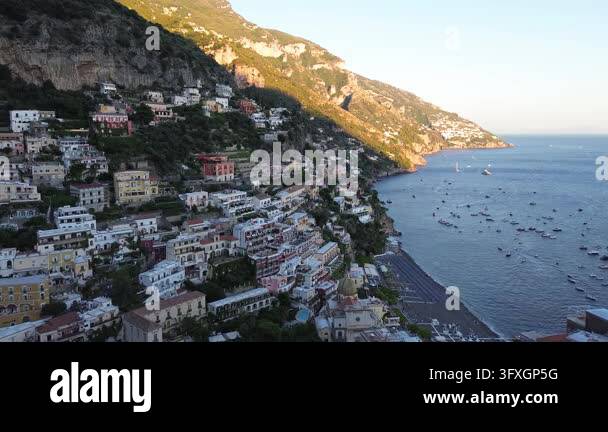 Beatiful Italian Model Thyrenian Sea and row of bright umbrellas on beach of Positano - famous ...