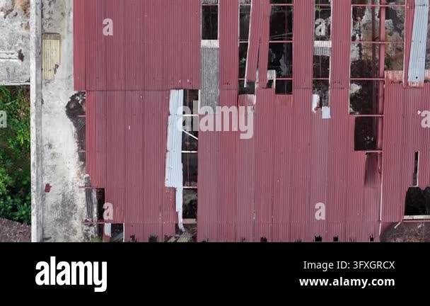 Aerial view of abandoned red structure. Broken walls and shattered ...