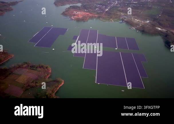 Powerful Pv Array Drone aerial of large floating photovoltaic arrays on Karangkates ...