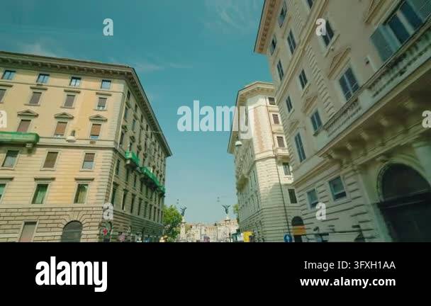 Rome, Italy August 20, 2026: A moving tour bus passes grand historic ...