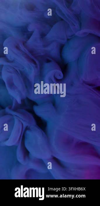 Vertical video. Ink splash. Mist art. Defocused neon purple pink blue ...