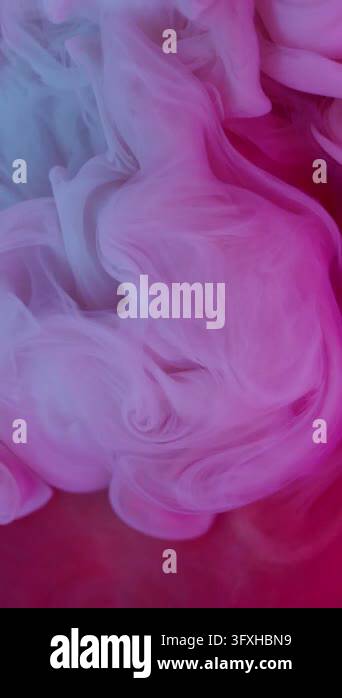 Exploding Mist Vertical video. Steam fluid mix. Explosion mist. Defocused neon pink ...