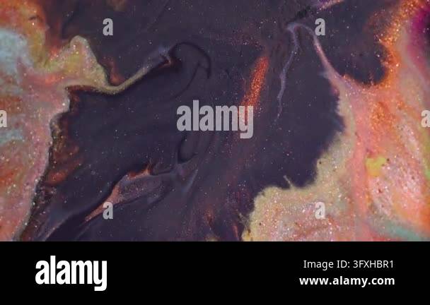 Ink wave. Glitter emulsion paint. Defocused orange purple yellow ...