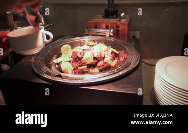 Black Pudding and Roasted Potatoes at a Buffet Stock Video Footage - Alamy