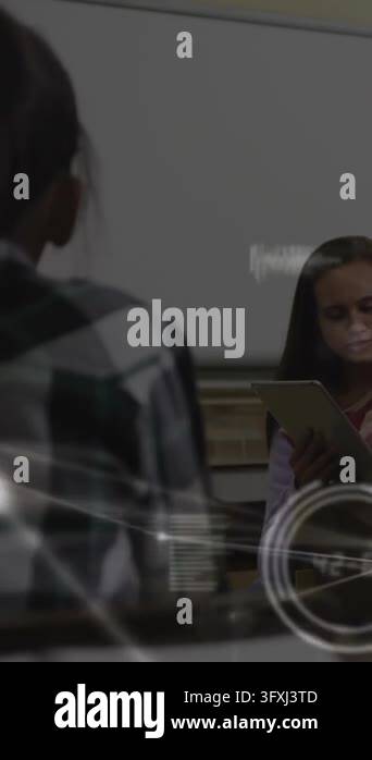 Vertical video: After teacher cue, right girl in cardigan reading ...