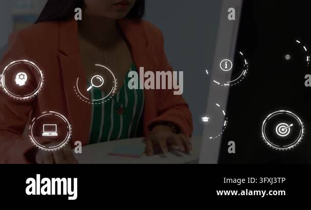 Woman typing and clicking at desk, causing HUD icons aligning over ...