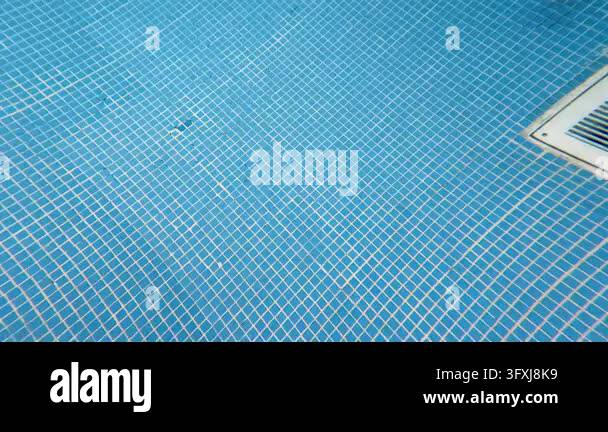 Underwater Slow Motion Tracking Shot Over Small Blue Tiles on Pool ...