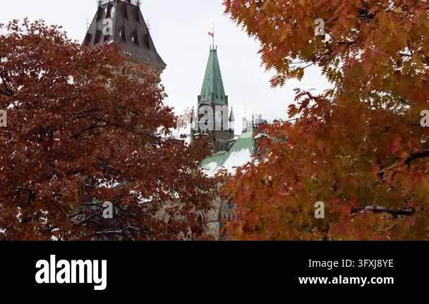 Parliament of Canada with Canadian flag and autumn trees in Ottawa ...