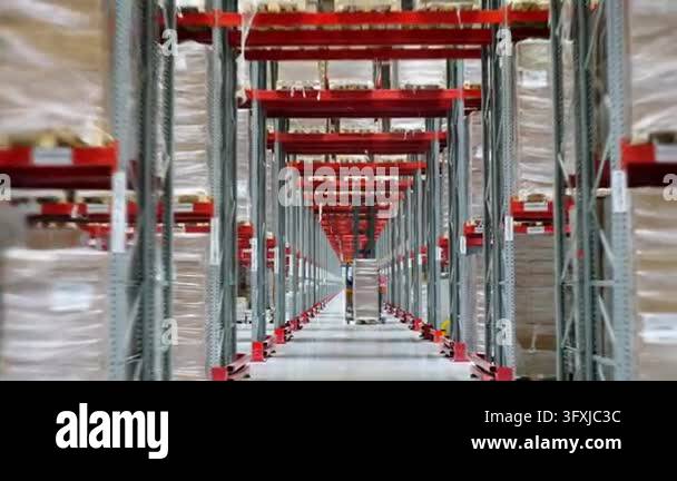 Three Large Warehouse Vector Forklift transports a pallet of packaged goods through a large ...