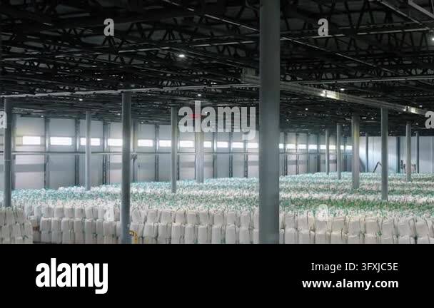 Three Large Warehouse Vector Massive industrial warehouse filled with rows of white bulk bags used ...