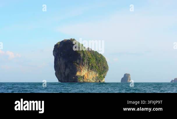 Slow motion panning shot from tour boat toward iconic heart-shaped ...