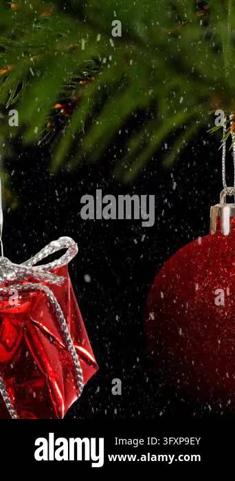 Snow Falling 4k Animation Animation of snow falling over hanging baubles and christmas gifts on a ...