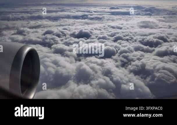 Jet engine visible from a passenger window as a commercial airplane ...