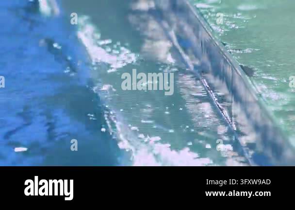 Water Ripple Background 4k Sparkling turquoise pool water close up, sun glare shimmering rippling ...