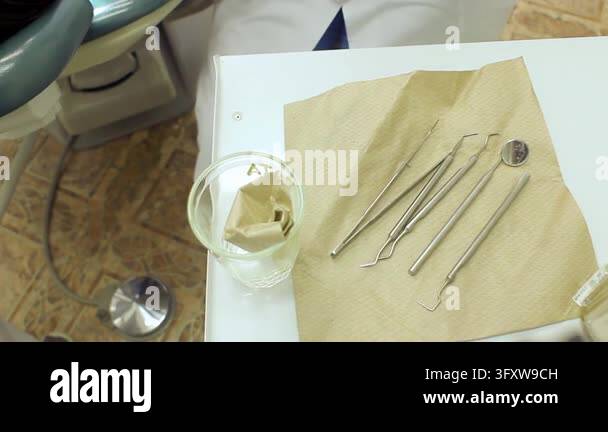 Probe Instrment Dental instruments close up tray, dentist hands latex gloves picking ...