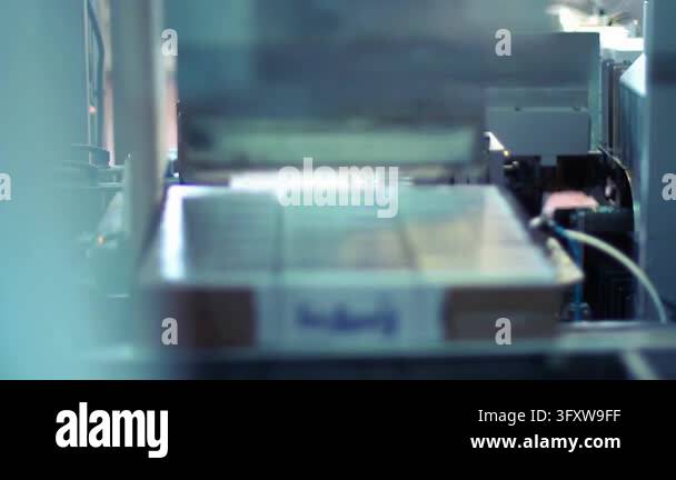 Infant formula boxes passing packaging machine food factory. Baby milk ...