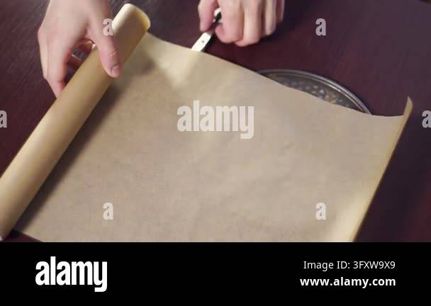 Parchment baking paper roll cut scissors lining cake tin pizza tray ...