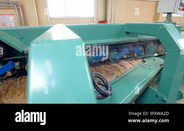 Industrial equipment processing flax fiber, rotating rollers pulleys ...