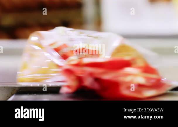 Sliced bread loaves plastic bags moving conveyor belt factory packing ...