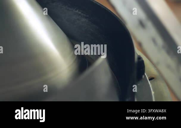 Dough rounding machine shaping portion closeup, spinning steel cone ...