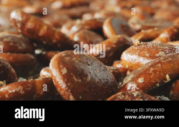 Gingerbread production food factory, glazed honey cookies macro closeup ...