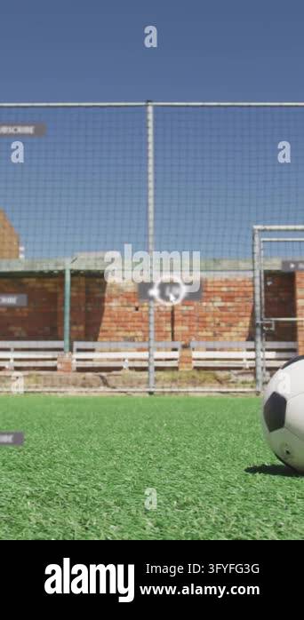 Social media concept icons against male soccer player taking a freekick ...