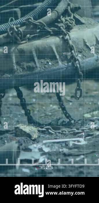 Animating green financial graph over industrial machinery in scrapyard ...