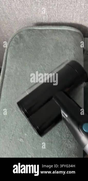 Sofa Clean Vector Close-up of a handheld vacuum cleaner removing dust, lint and pet hair ...