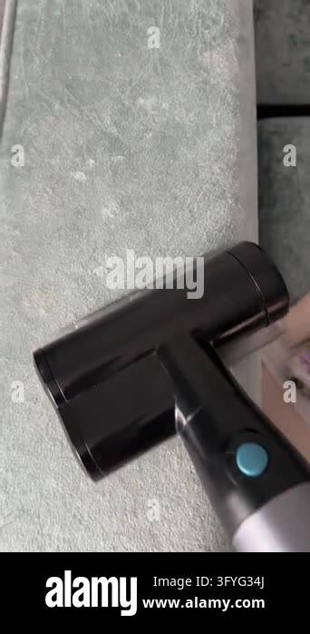 Sofa Clean Vector Close-up of a handheld vacuum cleaner removing dust, lint and pet hair ...