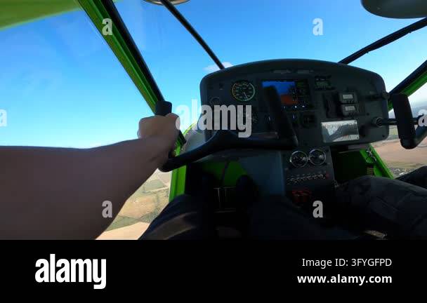 Forward view from small private aircraft flight deck showing aviator ...