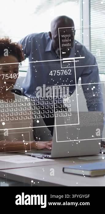 Vertical video: Business staffer typing while boss leaning over laptop ...