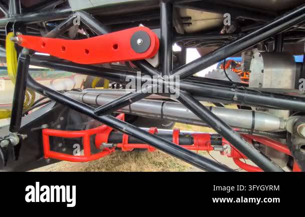 Underneath video view of a custom race truck frame displaying red ...